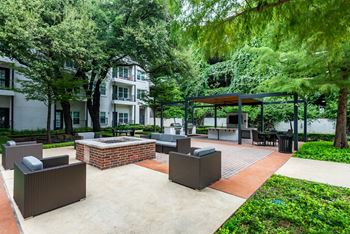 Outdoor fireplace with lounge seating